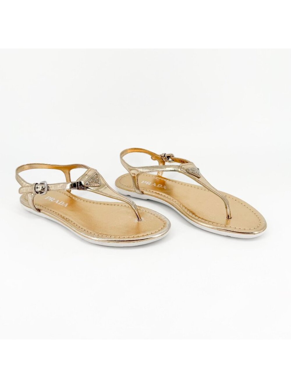 Prada Triangle Logo T-Strap Flat Sandals Gold Leather Size 37.5 US 7.5 Womenโs